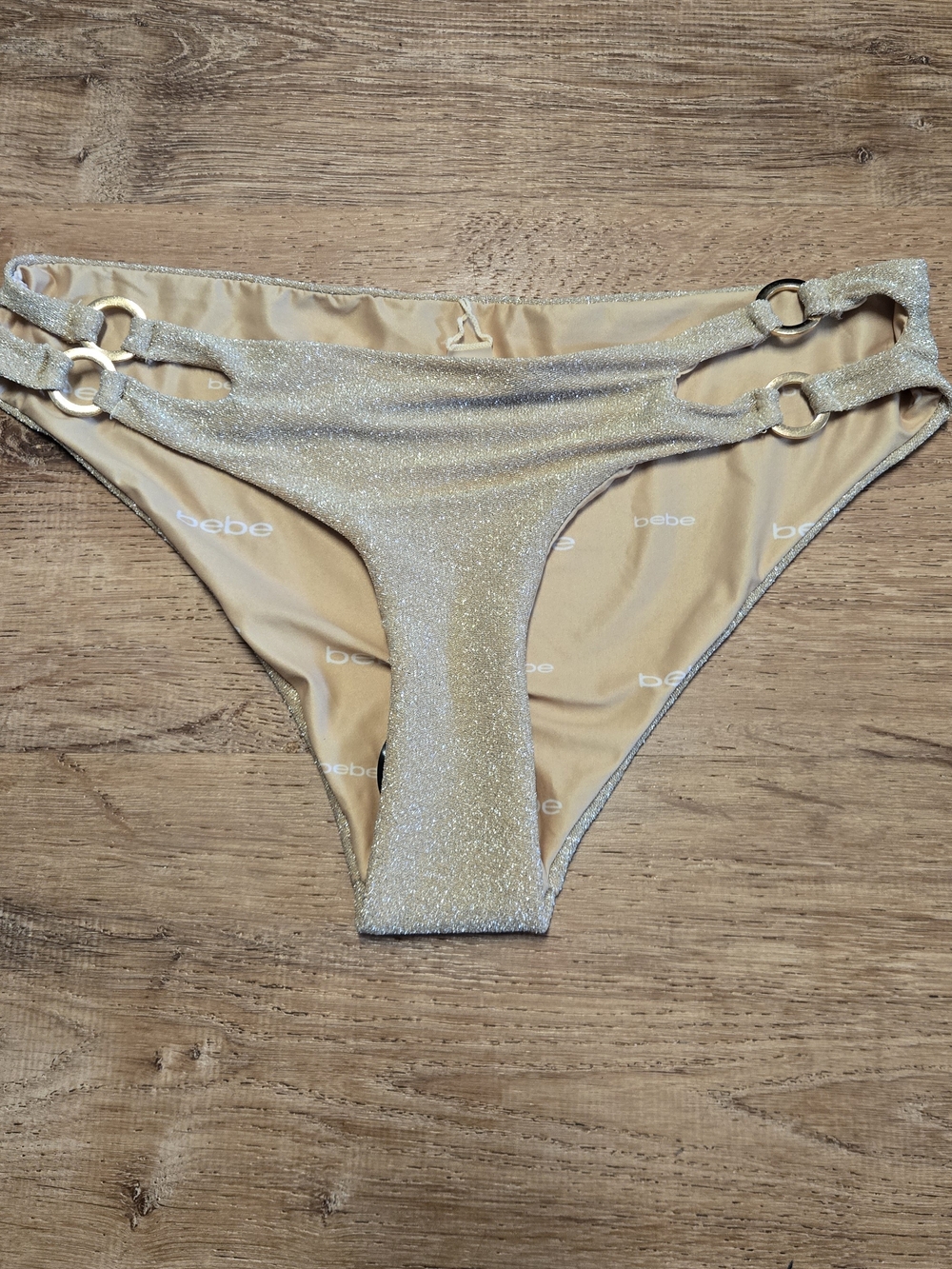NWOT bebe Gold Shimmer Ring-Side Bikini Bottom Medium
